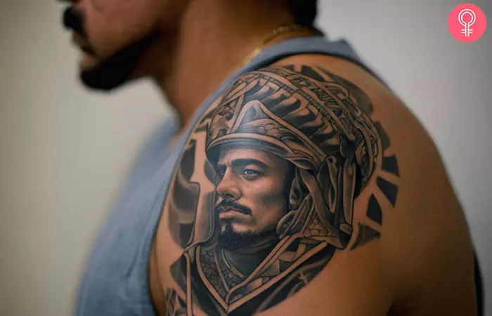 A man with a Chicano prison tattoo on his upper arm