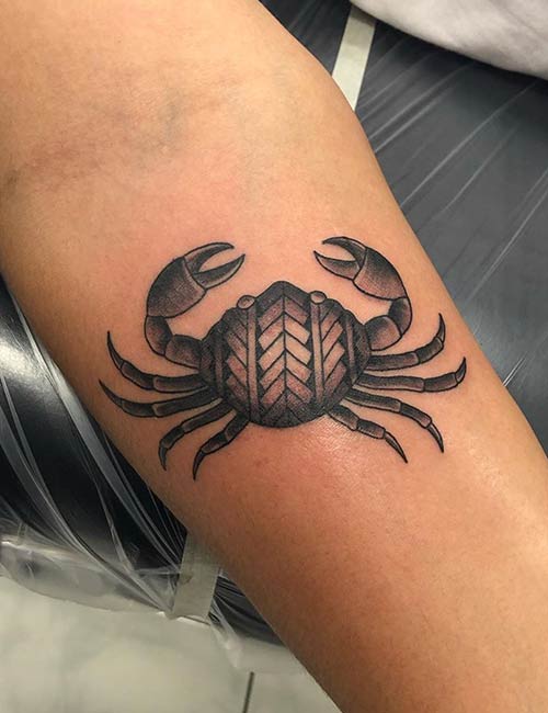 Hawaiian crab tattoo design on forearm