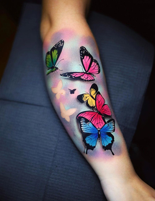 Vibrant watercolor butterfly design for forearm tattoo