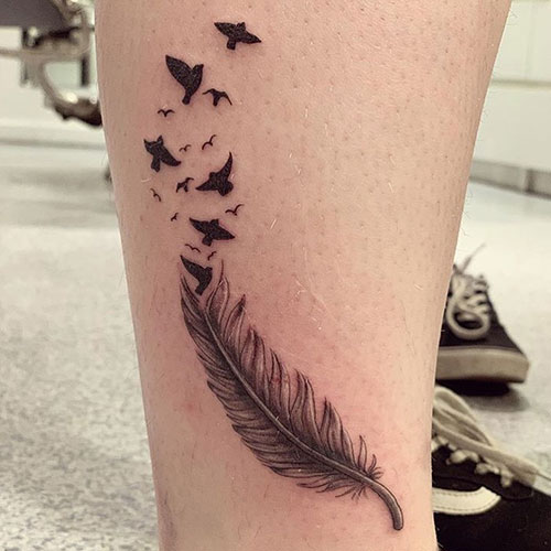 Feather and bird tattoo
