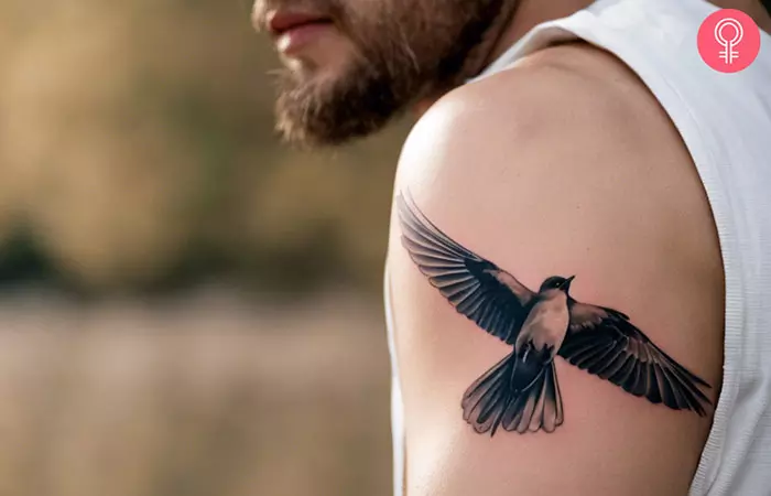 A man with a French prison tattoo on his upper arm