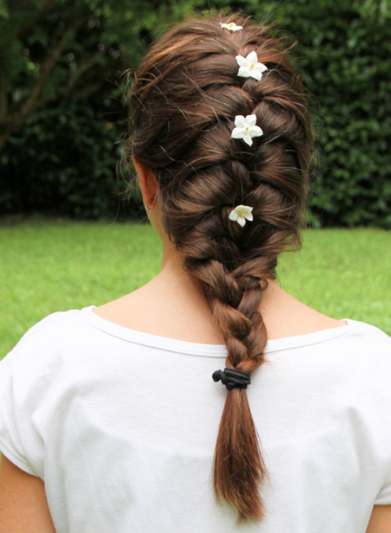 French braid hairstyle with flowers