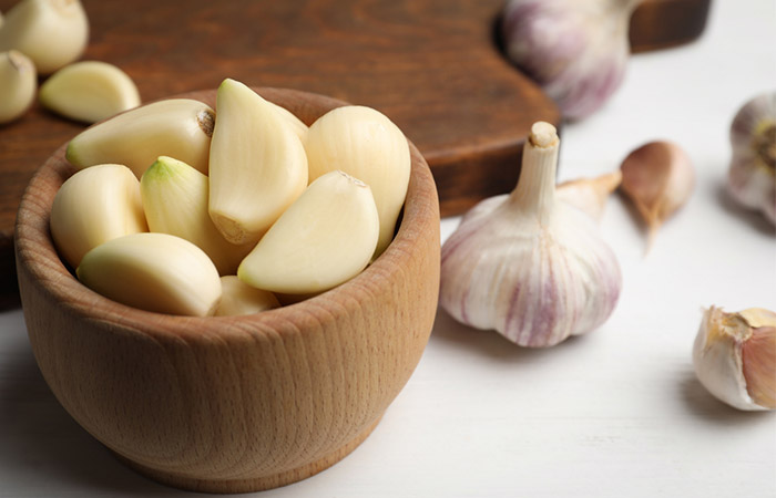 Fresh garlic to treat pimples behind ears.