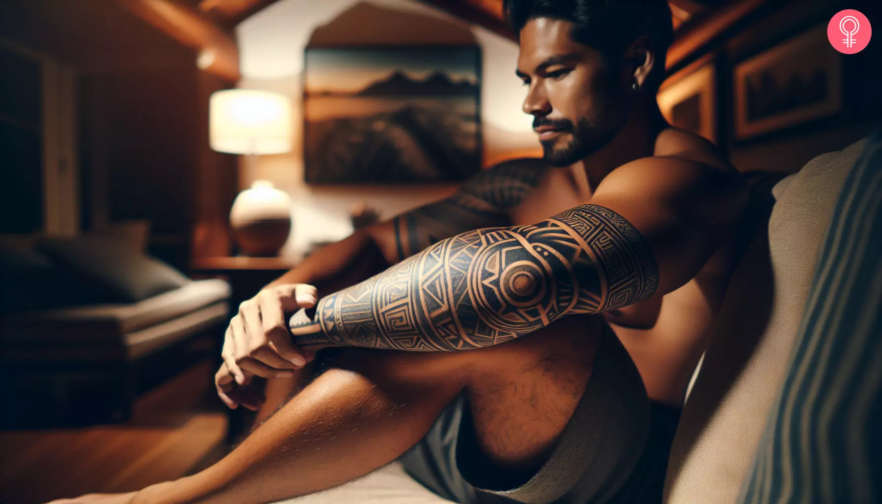 A geometric Mayan tattoo design on a man’s arm