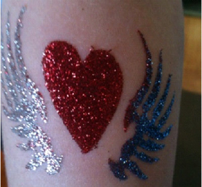 Glitter hearts on wings tattoo