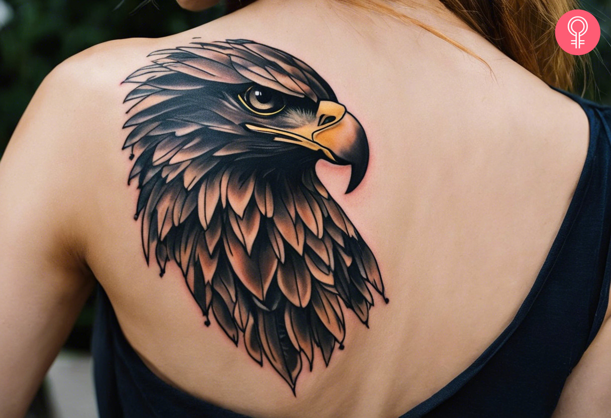 A realistic Eagle head tattoo on the upper back