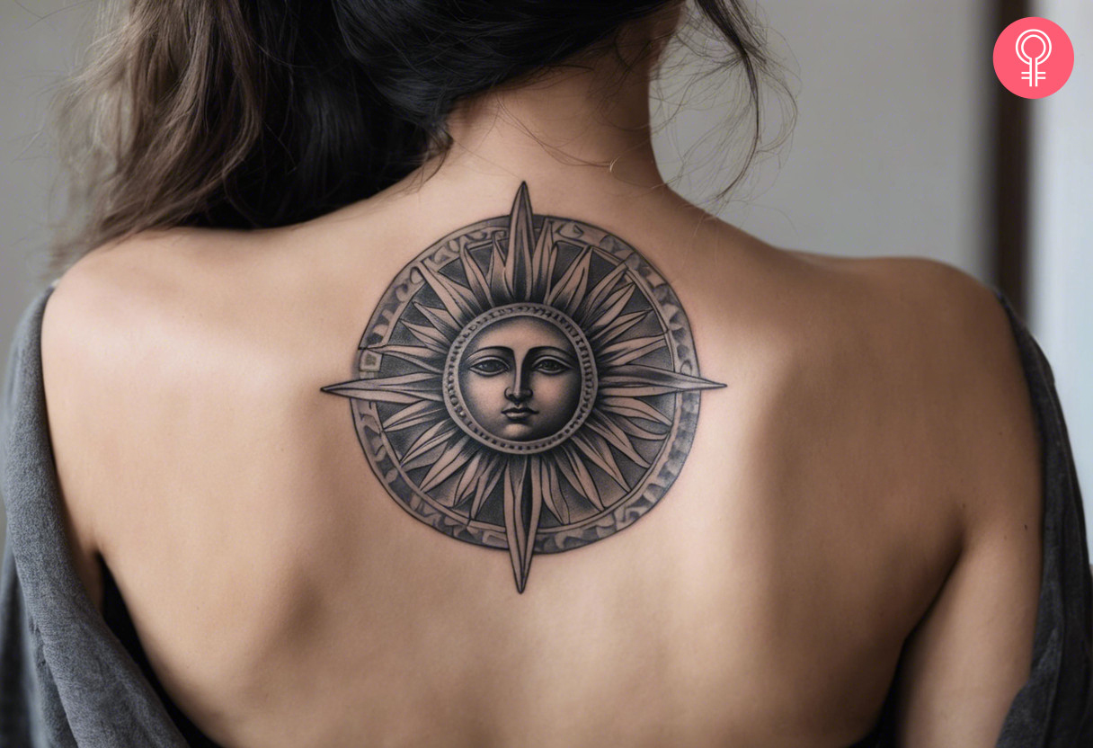 A black and grey sun tattoo with the face of Apollo in the middle