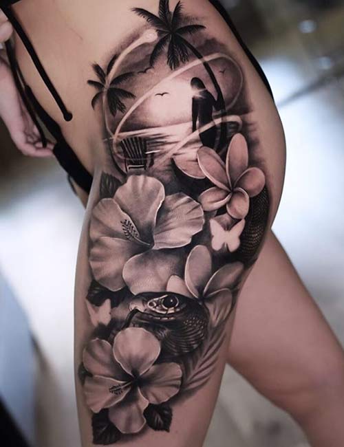 Hawaiian floral tattoo design on thigh