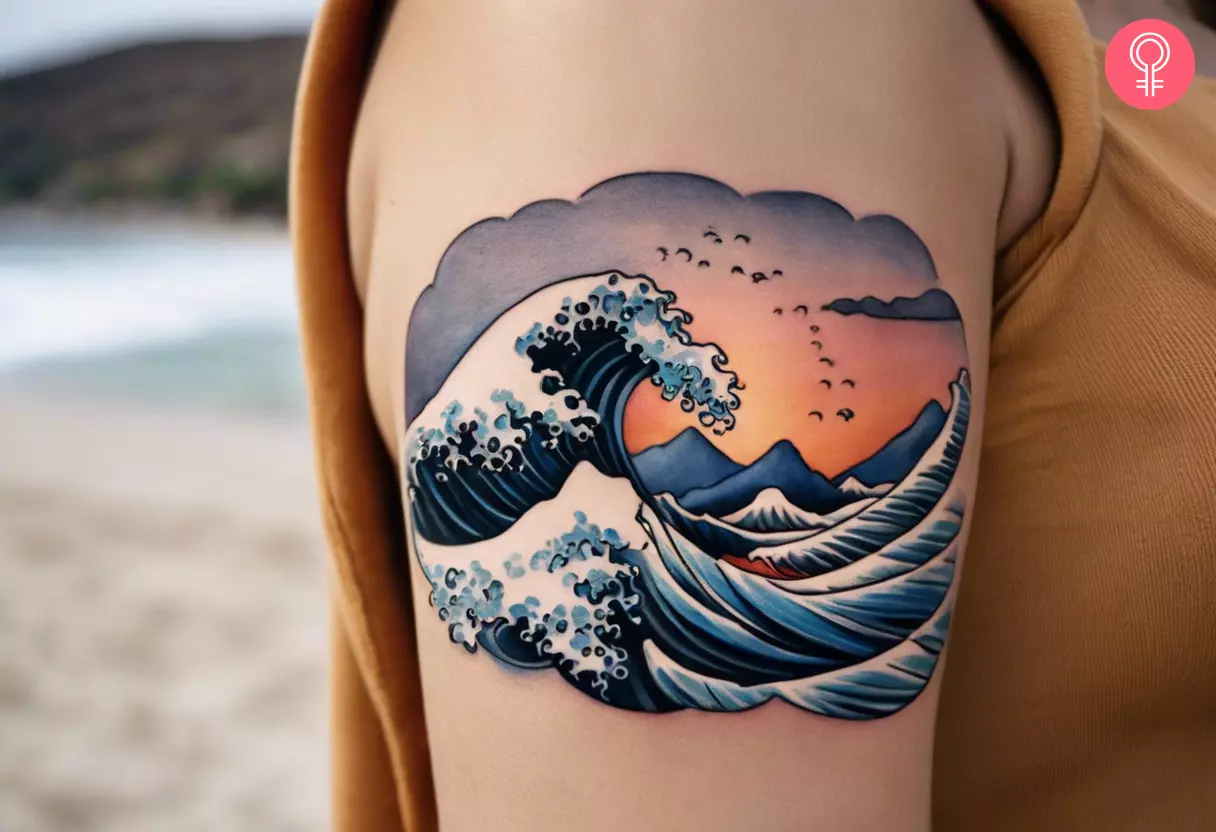 A Hawaiian ocean tattoo on a woman’s upper arm