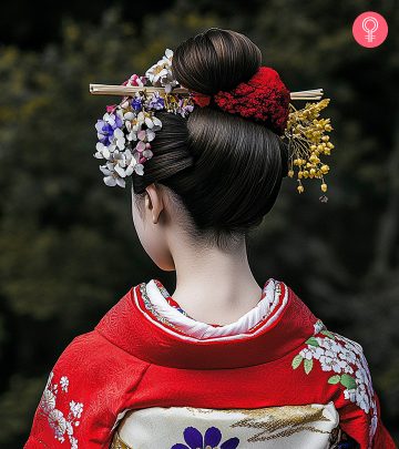 A woman with a red-colored fluffy pixie haircut