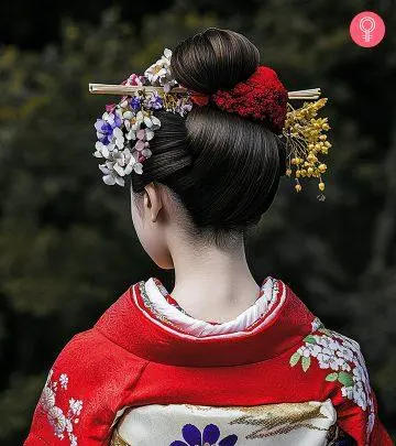 A woman with a red-colored fluffy pixie haircut