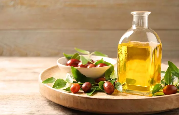 Jojoba oil as a natural way to reduce forehead wrinkles at home.