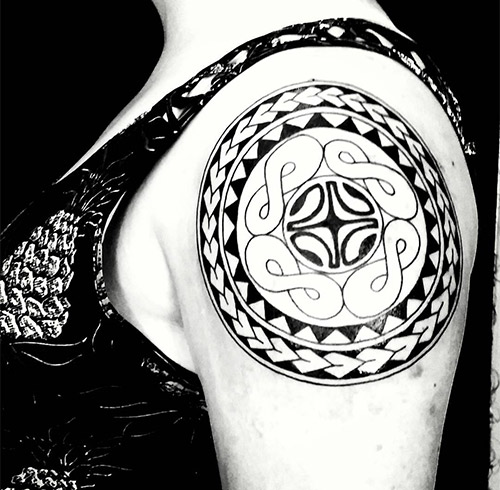 The popular marquesan cross tattoo symbolizing harmony in Polynesian culture