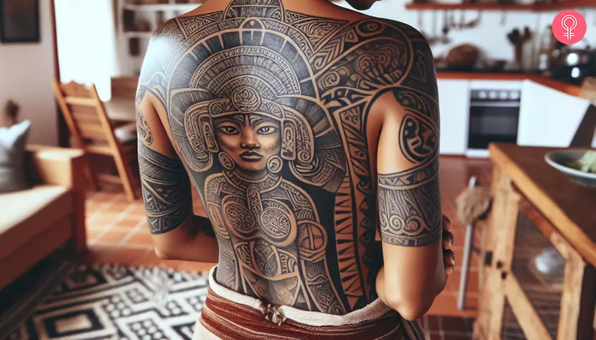 A Mayan goddess tattoo on a woman’s back