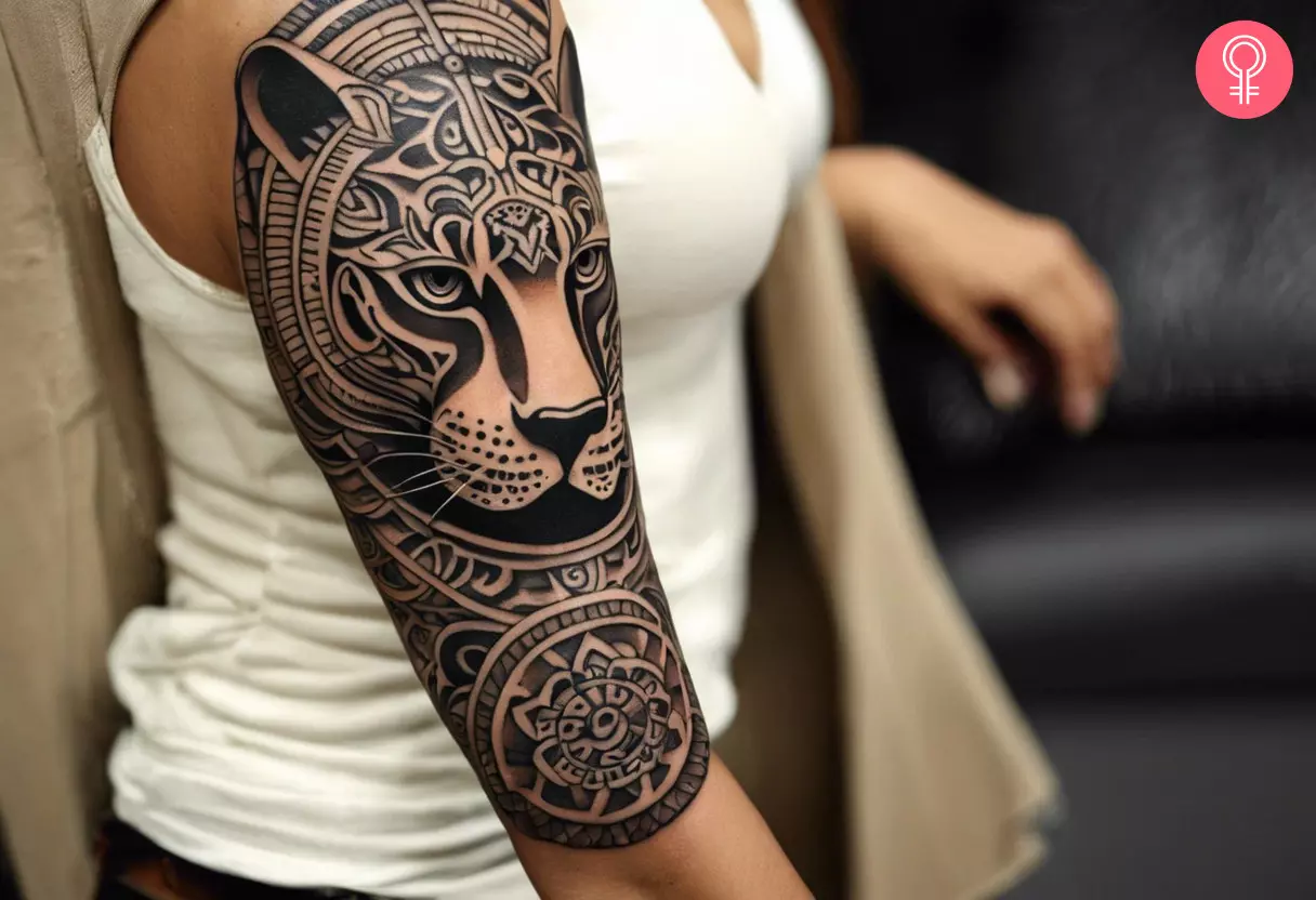 A Mayan jaguar tattoo on a woman’s arm