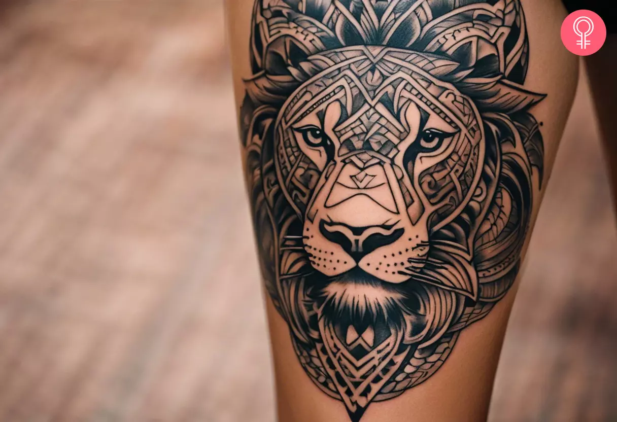 A Mayan lion tattoo on a woman’s calf