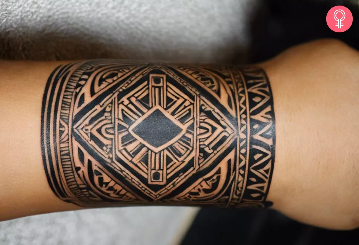 A Mayan pattern tattoo on a woman’s wrist
