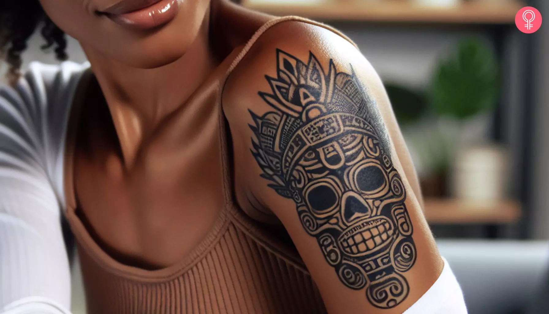 Mayan skull tattoo on a woman’s bicep