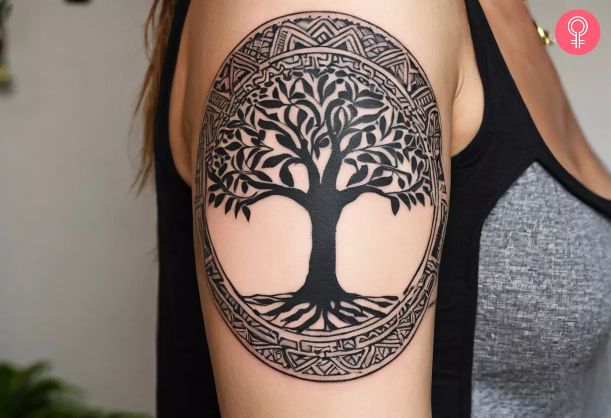 A Mayan tree of life tattoo on a woman’s bicep