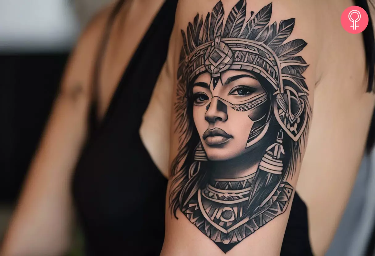 A Mayan warrior tattoo on a woman’s arm