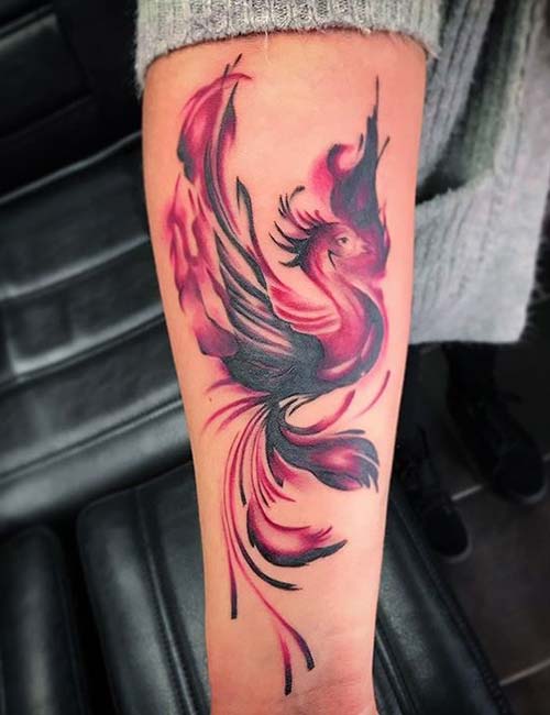 Phoenix whirlong up the arm tattoo design