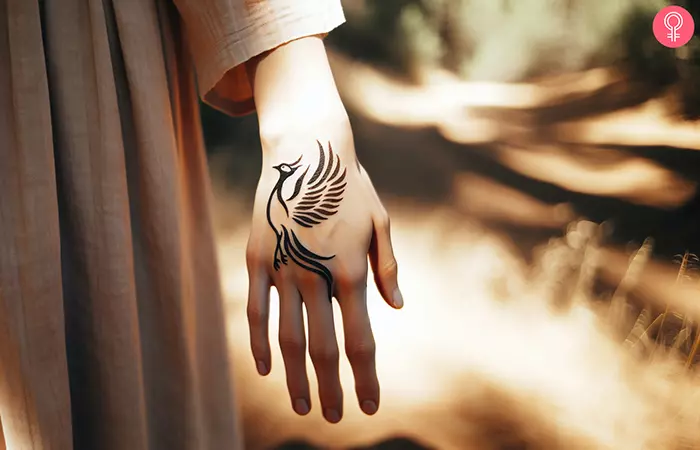 Phoenix hand tattoo