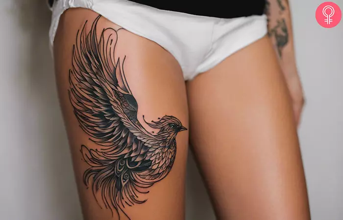 Phoenix thigh tattoo