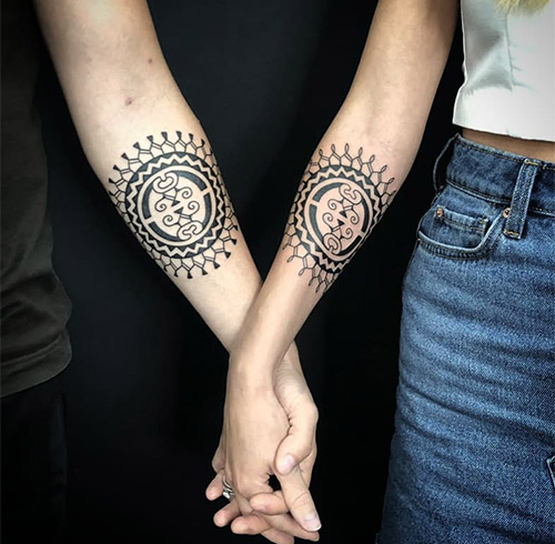 The ubiquitous Polynesian shell tattoo for the arms