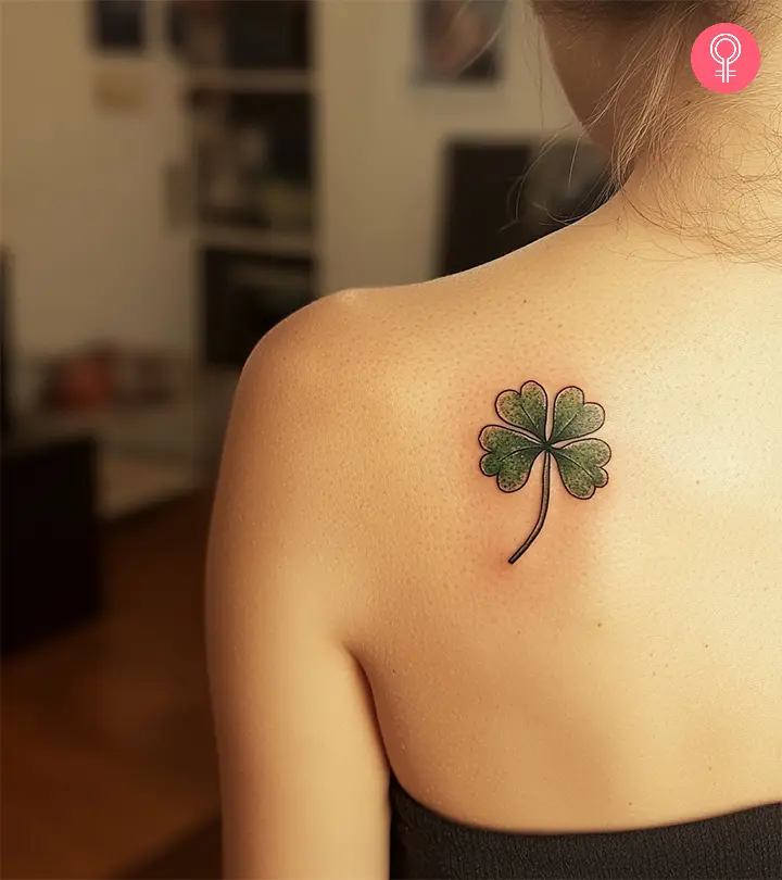 Woman with a shamrock tattoo on her back