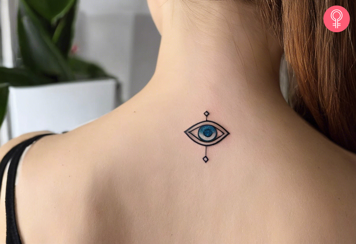 An evil eye tattoo on the back of the neck