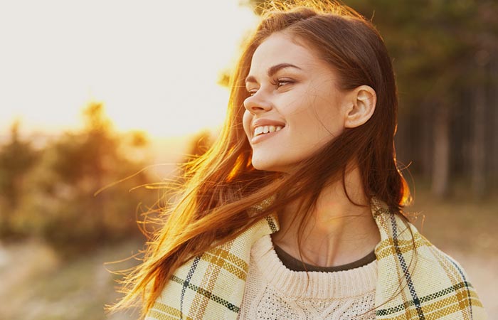 Woman smiling in sunlight