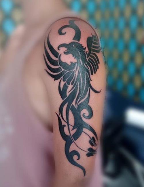 tribal phoenix arm tattoos for men