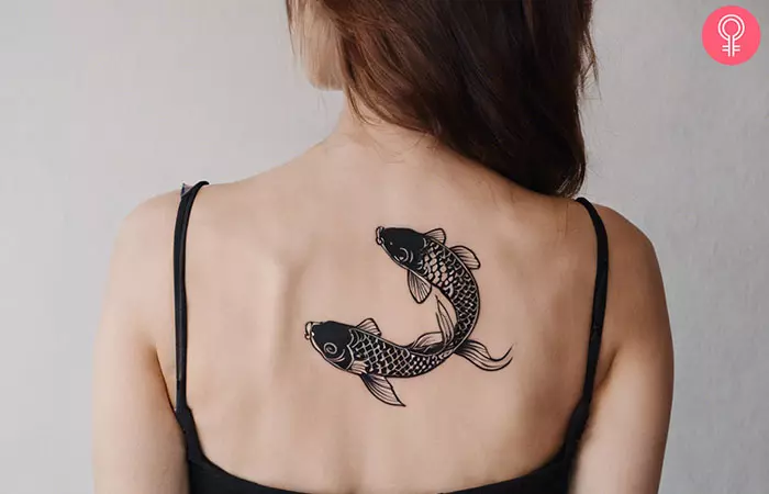 Two Koi fish tattoo on the back
