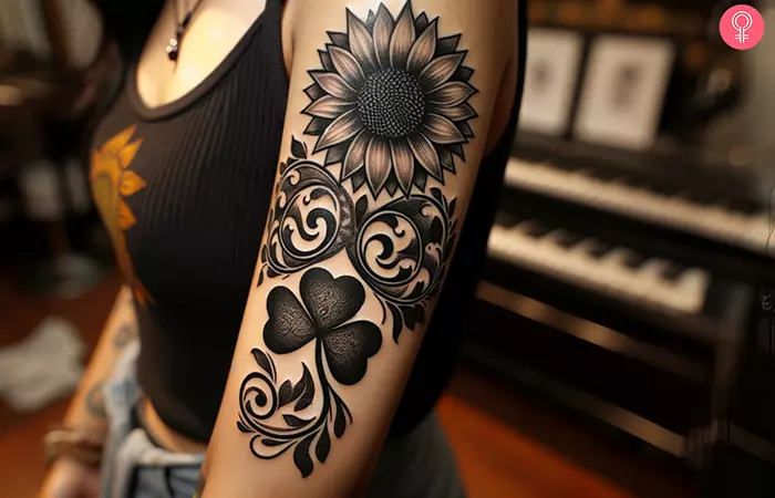 Woman-with-a-black-and-grey-shamrock-tattoo-on-her-upper-arm