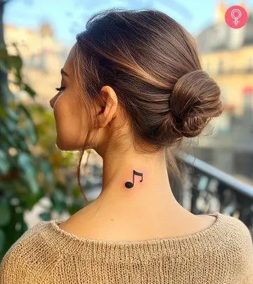 Woman-with-a-musical-tattoo-on-her-left-shoulder