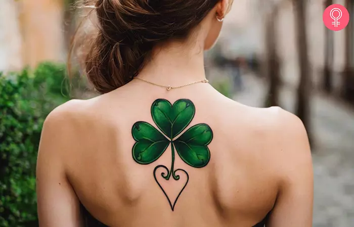 Woman-with-a-shamrock-heart-tattoo-on-her-upper-back