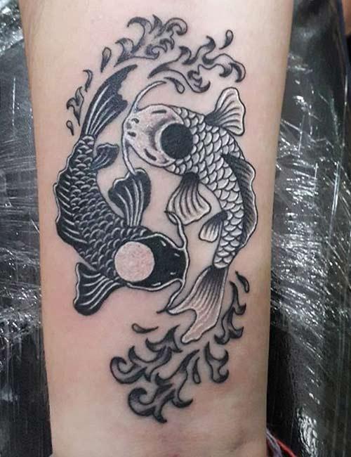 Yin and Yang koi fish couple tattoo