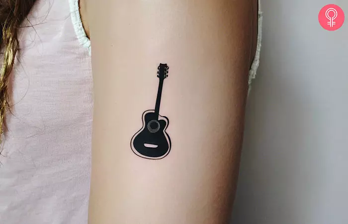 minimalist guitar tattoo