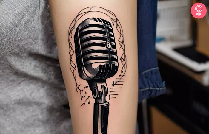 music microphone tattoo on the arm