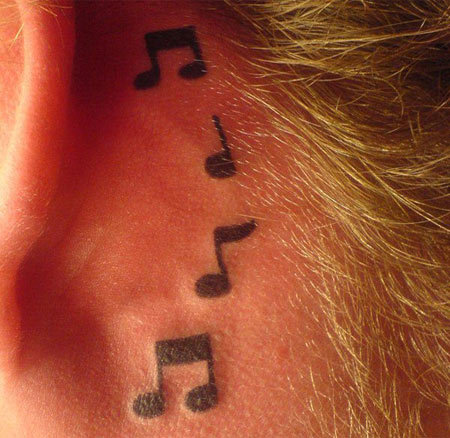 Music notes behind the ear tattoo design