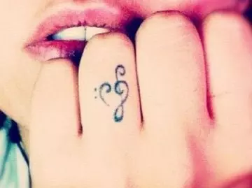 Music note on the finger tattoo design