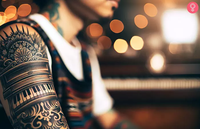 piano tattoo on the arm