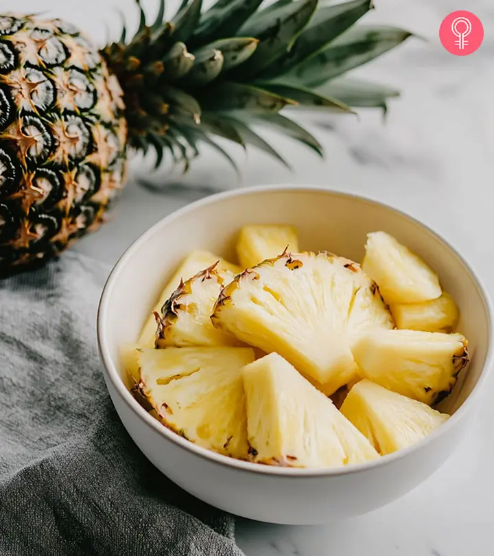 A-woman-holding-pineapple