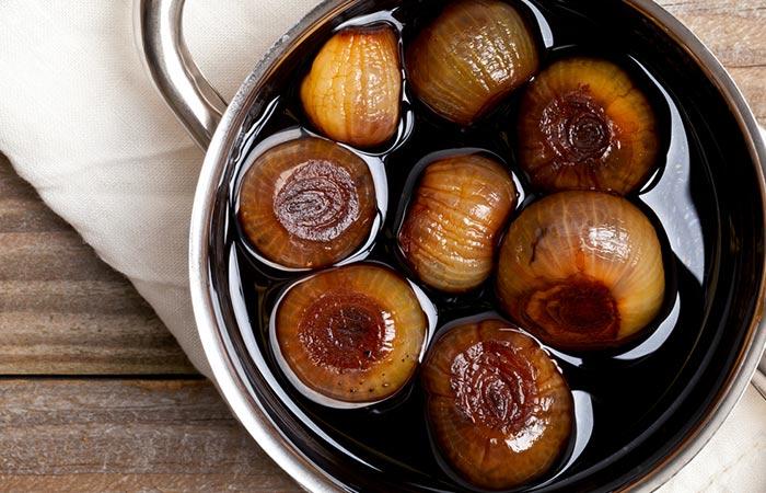 Pickling shallot bulbs in vinegar.