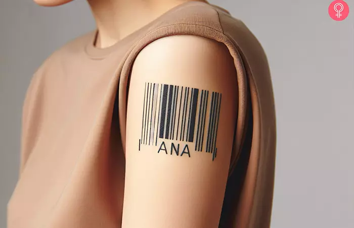 A black ink barcode tattoo with a name on the upper arm
