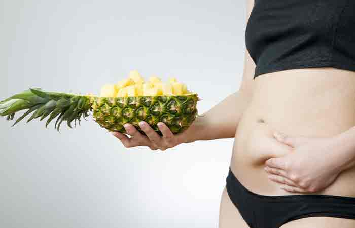 Woman holding pineapple