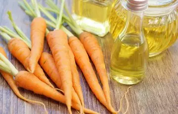 Some carrots beside carrot oil