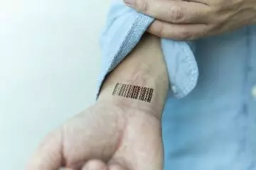 DNA barcode tattoo design on wrist