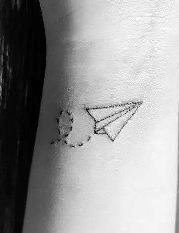 Flying paper plane tattoo design