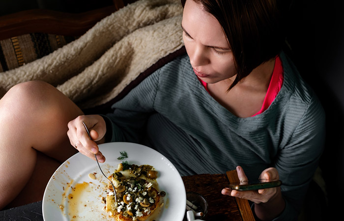 Woman eating capers for its immense health benefits